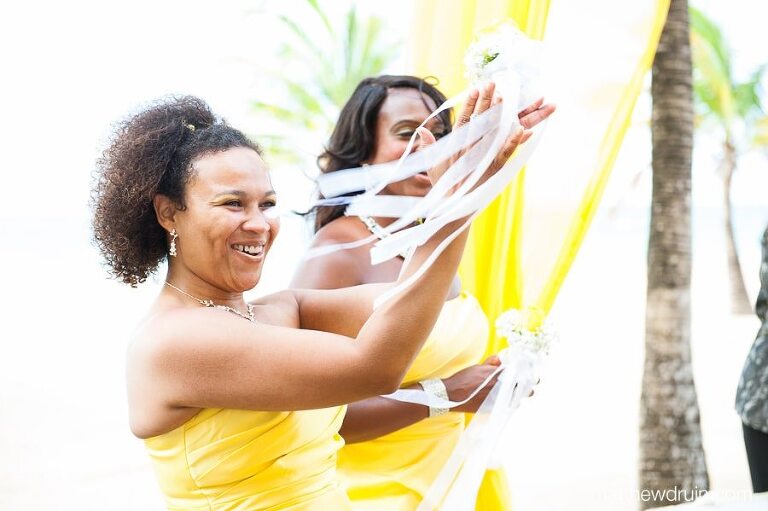 bridesmaids in yellow dresses cheering at Puerto Rico wedding ceremony 