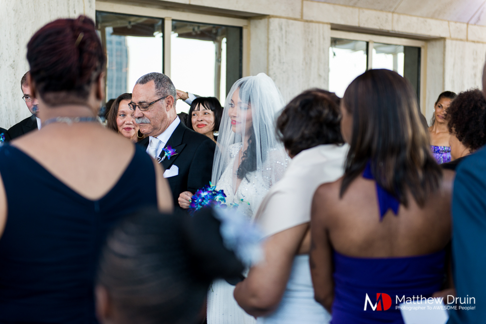 Bride and father walking down aisle at The Peachtree Club wedding ceremony
