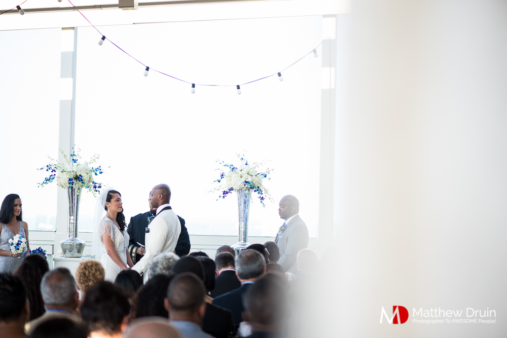 Bride and groom holding hands at The Peachtree Club wedding ceremony