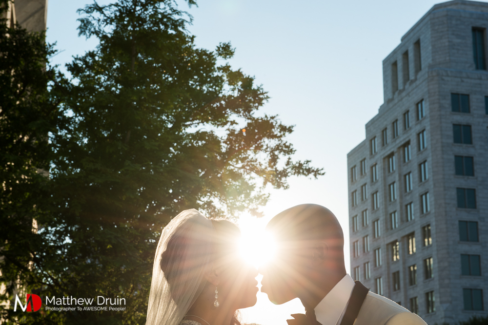 Bride and groom kissing in Atlanta at sunset at The Peachtree Club wedding