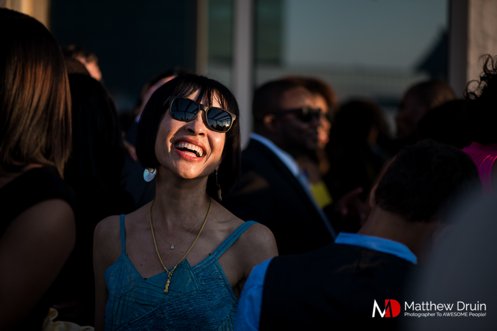 Wedding guests smiling at sunset at The Peachtree Club wedding reception