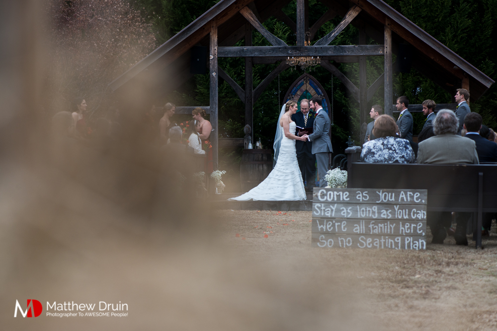 Bride and groom standing at alter at Atlanta Wedding Venue Proctor Farm In Georgia Review