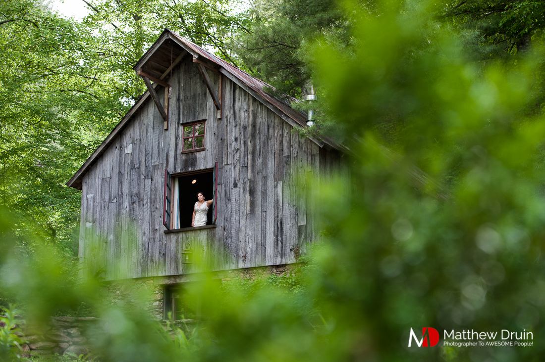 Bride looking out cottage window at vintage vineyard wedding at The Cellar at Betty Creek from Atlanta Wedding Photographers Matthew Druin + Co Photography.