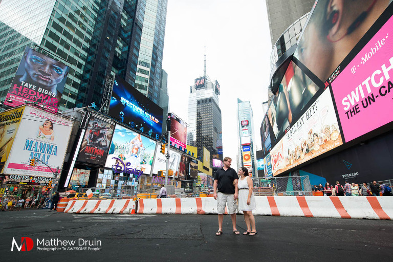 Engaged couple in Times Square in New York City engagement session from Atlanta wedding and portrait photographer Matt Druin.